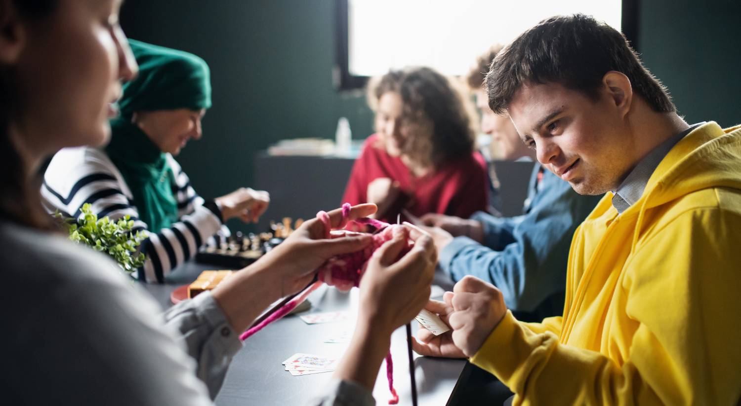 Group of people playing cards